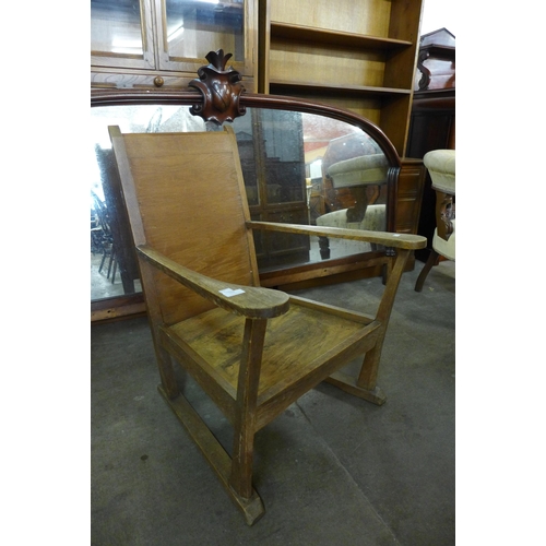 162 - An Arts and Crafts oak armchair