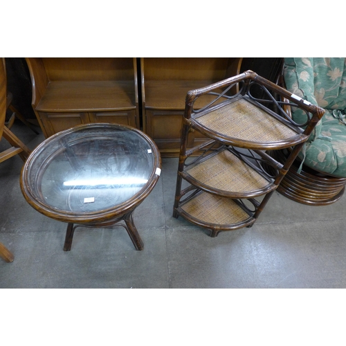 167 - A bamboo and glass topped circular coffee table and a corner whatnot