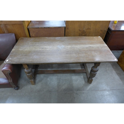 173 - A 17th Century style carved oak refectory table