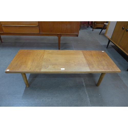 18 - A teak coffee table