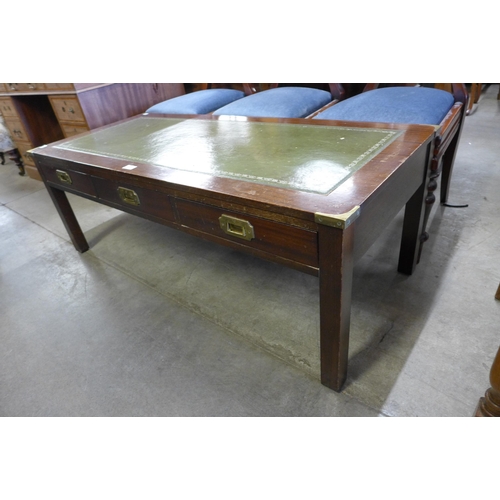 184 - A campaign style mahogany and green leather topped three drawer coffee table