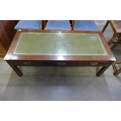 184 - A campaign style mahogany and green leather topped three drawer coffee table