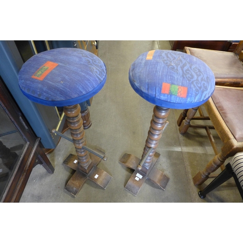 185 - A pair of French elm bar stools