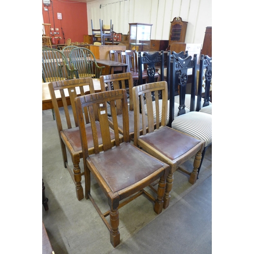 187 - A set of four oak dining chairs