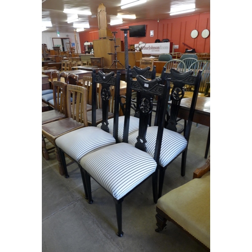 188 - A set of four Edward VII ebonised dining chairs