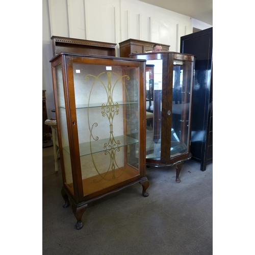 192 - Two walnut display cabinets