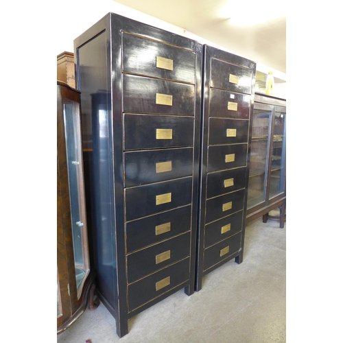 193 - A pair of black painted chests of drawers