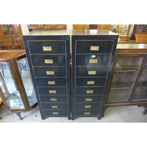 193 - A pair of black painted chests of drawers