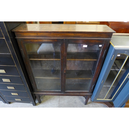 194 - An Edward VII oak two door bookcase