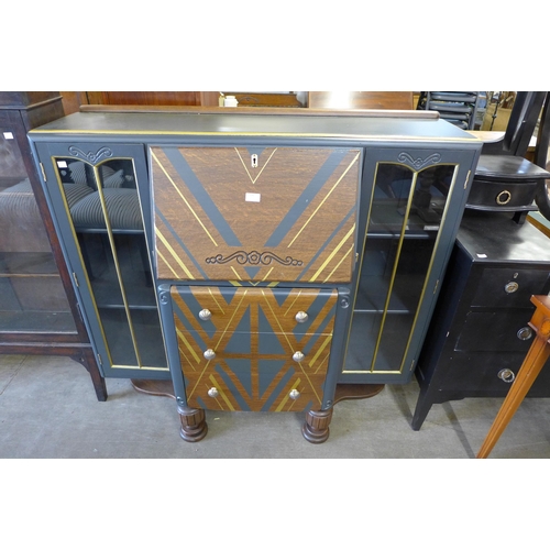 195 - A painted oak side by side bureau bookcase, an ebonised Edward VII dressing table and an inlaid maho... 