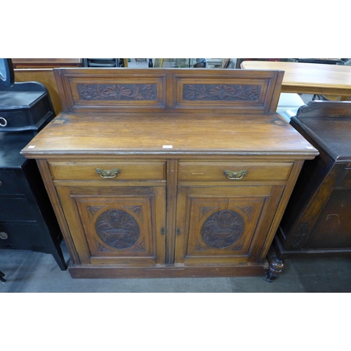 196 - An Edward VII carved walnut sideboard