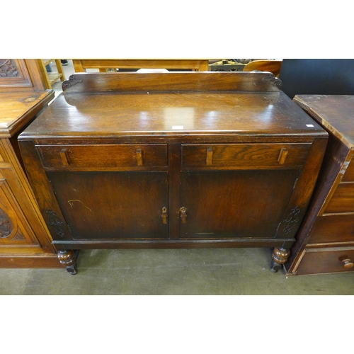 197 - A carved oak sideboard