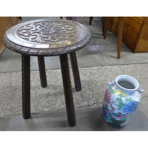 203 - A late Victorian carved mahogany stool and a Chinese famille vert porcelain vase