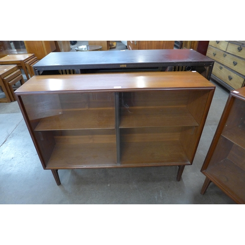 21 - A pair of teak bookcases