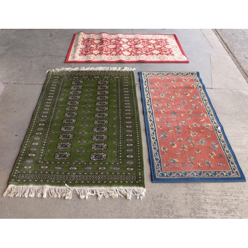 217 - Four assorted rugs