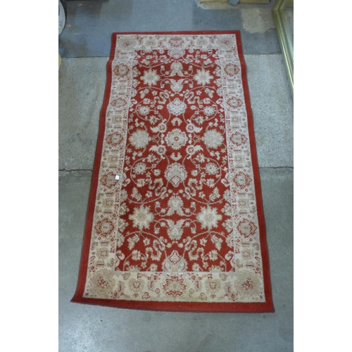 217 - Four assorted rugs