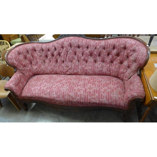 218 - A French carved mahogany and fabric upholstered settee