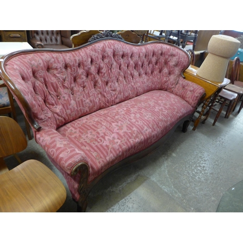 218 - A French carved mahogany and fabric upholstered settee