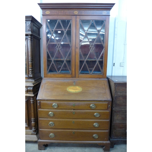 221 - A George III style inlaid mahogany bureau bookcase