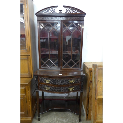 224 - An Edward VII Chippendale Revival carved mahogany serpentine side cabinet