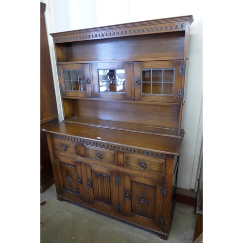 236 - A carved oak linenfold dresser