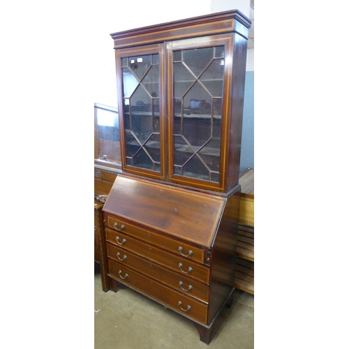 237 - An Edward VII inlaid mahogany bureau bookcase