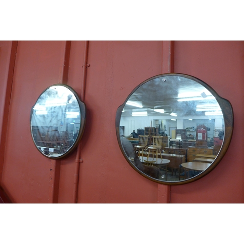 24 - A pair of Clark Eaton circular teak framed mirrors