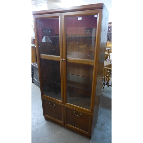 241 - A teak display cabinet