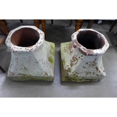 246 - A pair of terracotta chimney pot bases and a set of painted step ladders