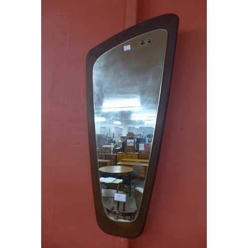 25 - A Danish teak asymmetrical framed mirror