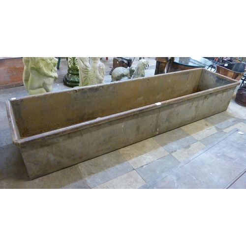 252A - A long galvanised trough