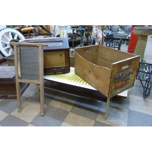 255 - A pine apple crate, a walnut valve radio, a Formica topped coffee table and a washboard