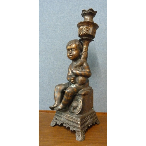 265 - A cast metal cherub plant stand