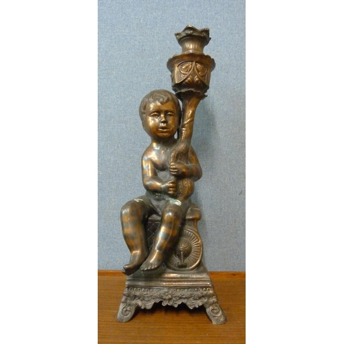 265 - A cast metal cherub plant stand