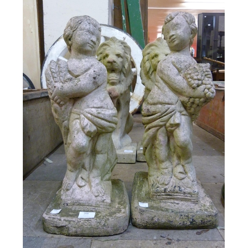 268 - A pair of concrete garden figures of cherubs