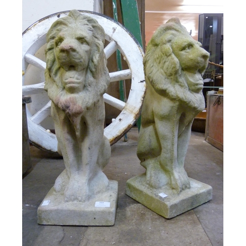 269 - A pair of concrete garden figures of seated lions