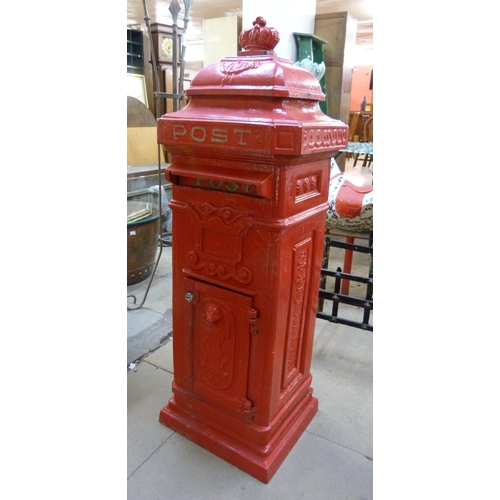 272 - A red painted cast iron post box, with key