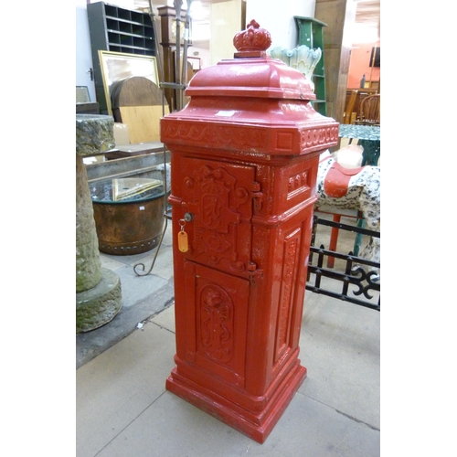 272 - A red painted cast iron post box, with key