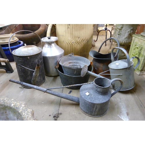 277 - A copper coal scuttle, galvanised watering cans, etc.