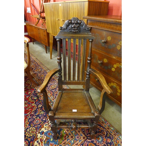 3 - A Victorian Jacobean Revival carved oak elbow chair