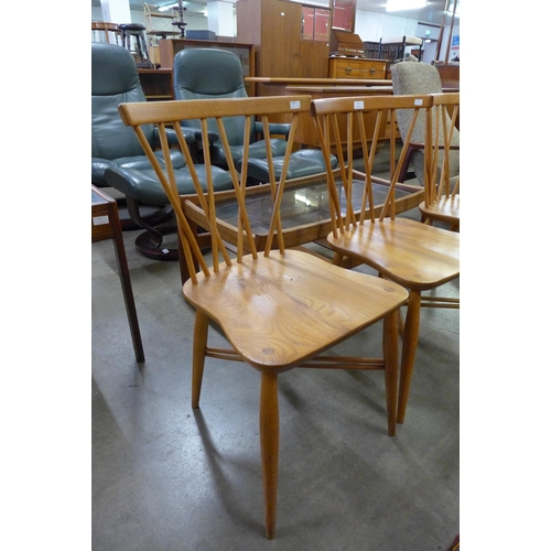 33 - A set of three Ercol Blonde elm and beech candlestick chairs