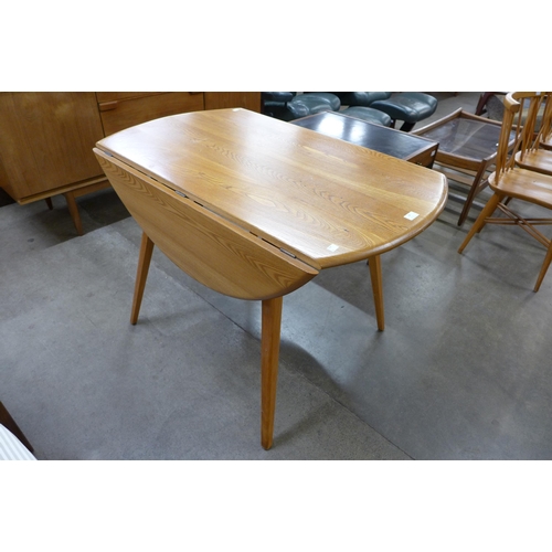 34 - An Ercol Blonde elm and beech Windsor drop-leaf table