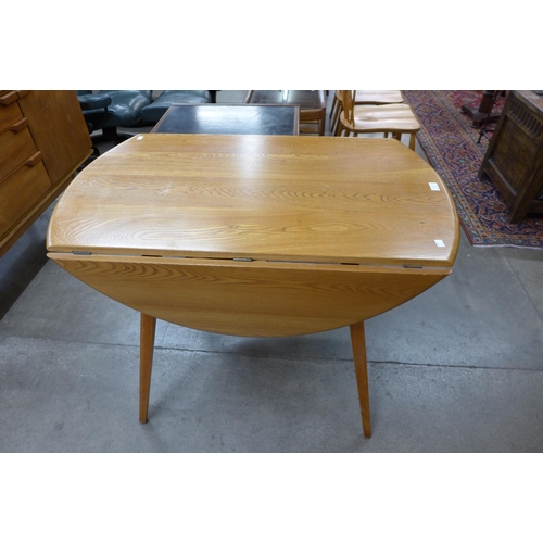 34 - An Ercol Blonde elm and beech Windsor drop-leaf table