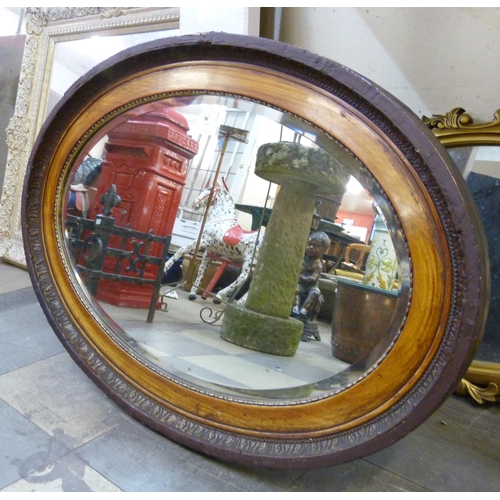 359 - A Victorian oval walnut framed mirror