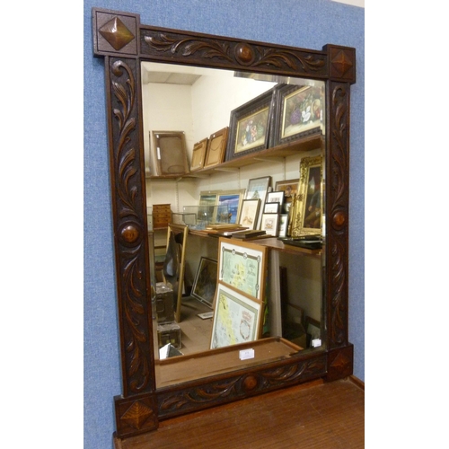 373 - An early 20th Century carved oak framed mirror