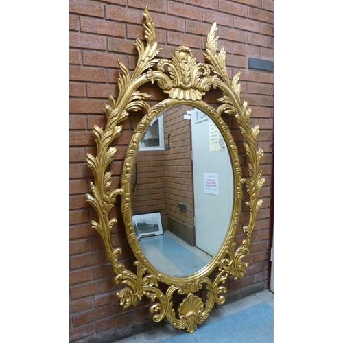 374 - A large rococo style gilt framed mirror