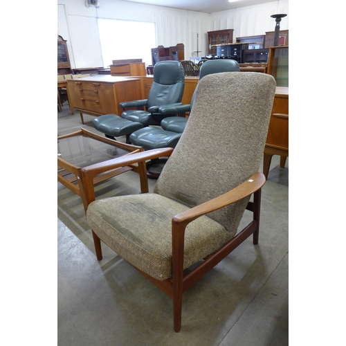 38 - A Swedish Dux teak armchair, designed by Folke Ohlsson. This lot is offered for sale as a work of ar... 