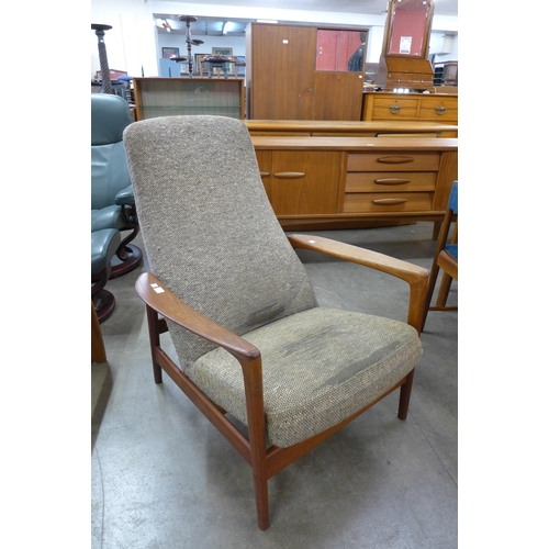 38 - A Swedish Dux teak armchair, designed by Folke Ohlsson. This lot is offered for sale as a work of ar... 