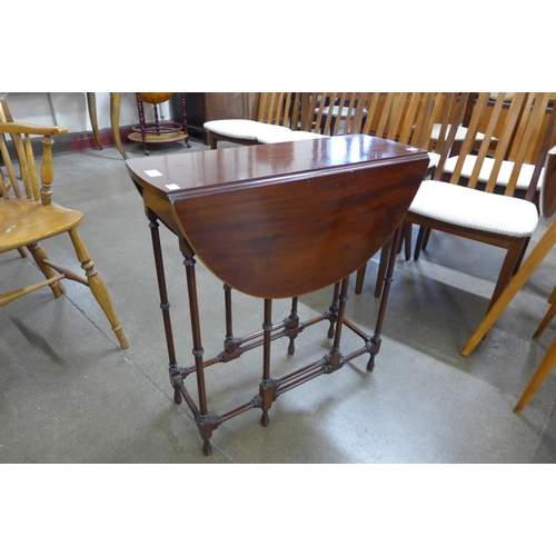 5 - An Edward VII inlaid mahogany spider-leg Sutherland table