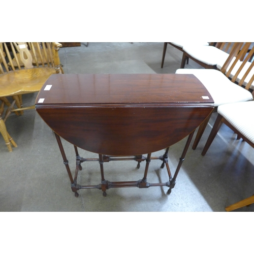 5 - An Edward VII inlaid mahogany spider-leg Sutherland table